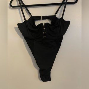 Victoria’s Secret Black Bodysuit with bustiers top and gold hardware. Size:L NWT